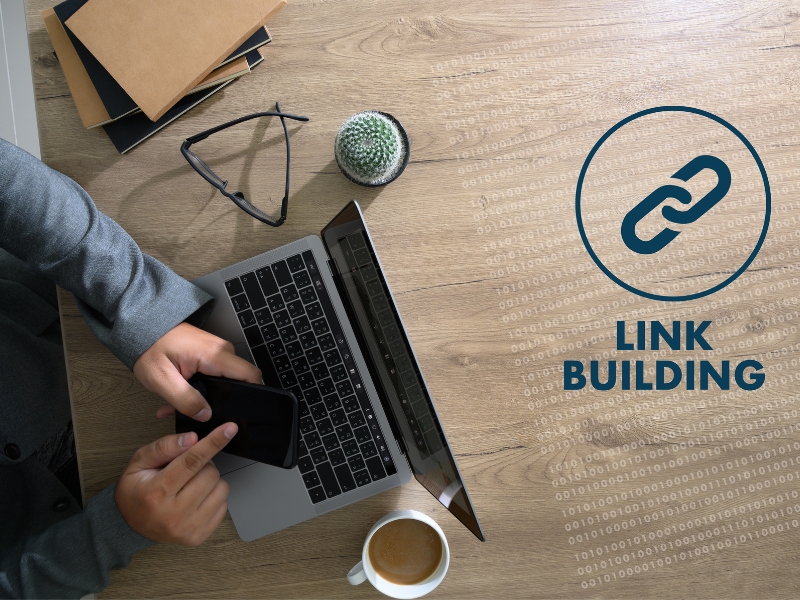 Link Building icon and a person working on a laptop at a desk.